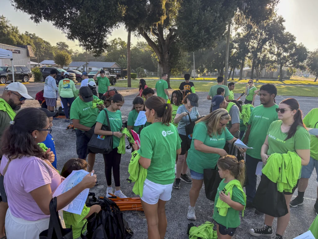 Large crowd of Publix Serves volunteers checking in and receiving shirts at a Bartow CRA community event