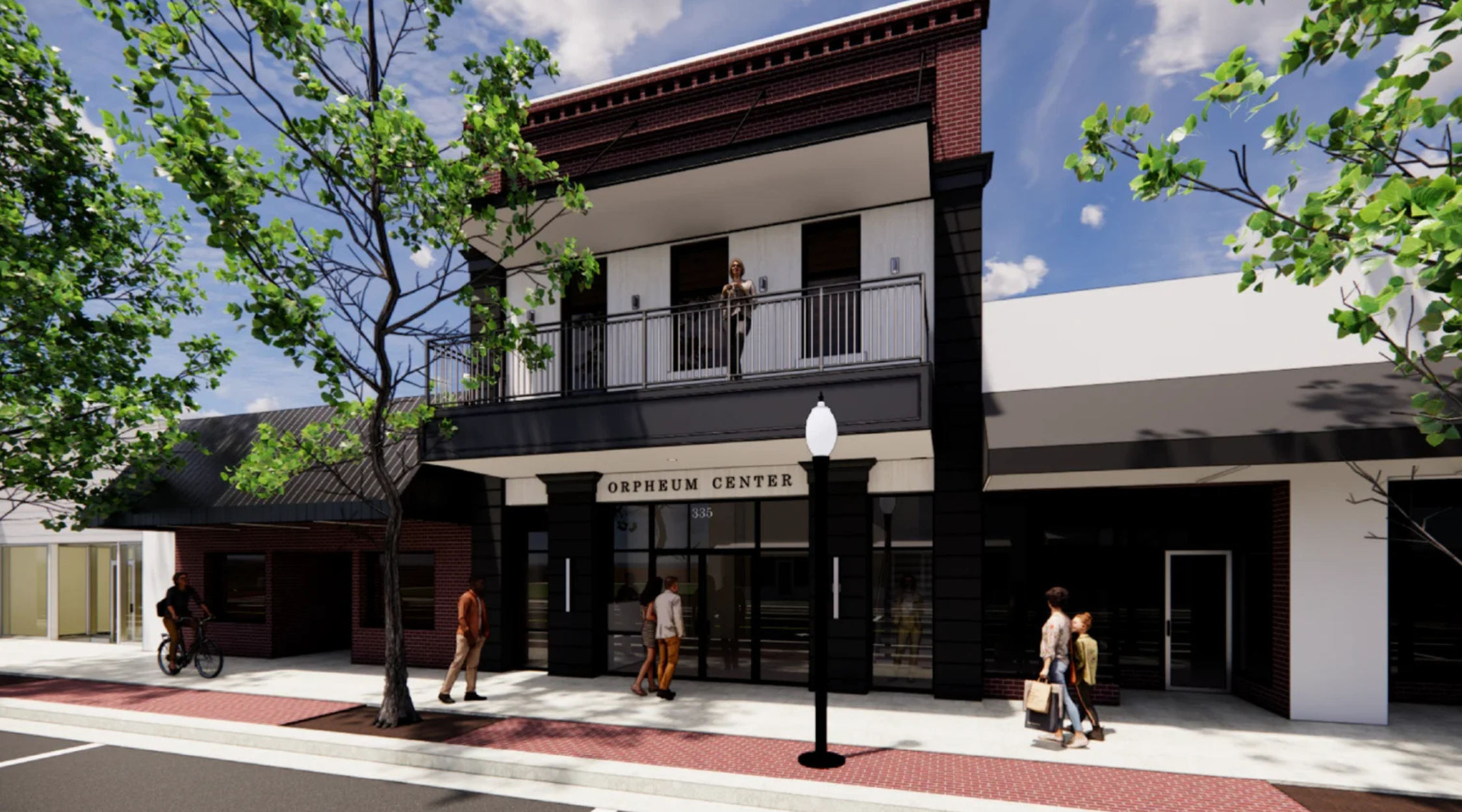 Architectural rendering of the Orpheum Center storefront at 335 Main Street with a second-floor balcony over the sidewalk