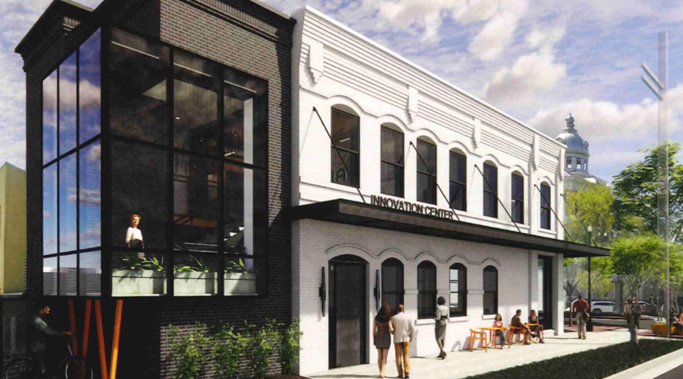 Architectural rendering of the Bartow Innovation Center storefront on Main Street with a glass corner addition and the courthouse dome in the background