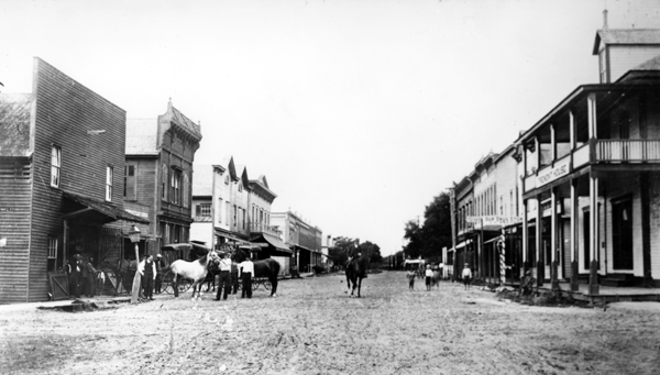 Historical photograph of downtown Bartow, Florida with horses and dirt streets in the early 1900s
