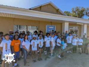 Volunteers painting a home during Paint Your Heart Out Bartow on July 11, 2026