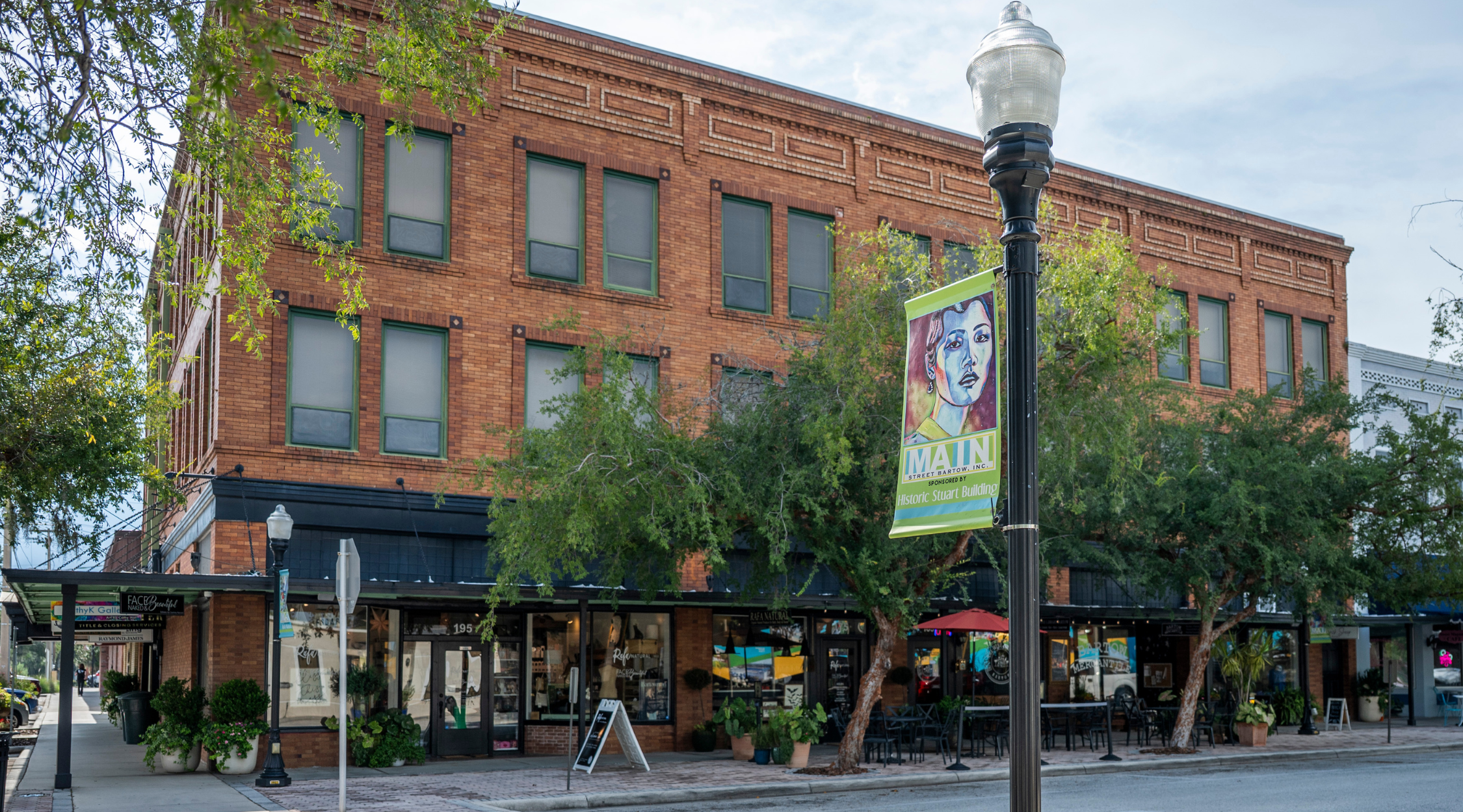 Historic Stuart Building on Main Street in downtown Bartow with a Main Street Bartow pole banner and street-level shops