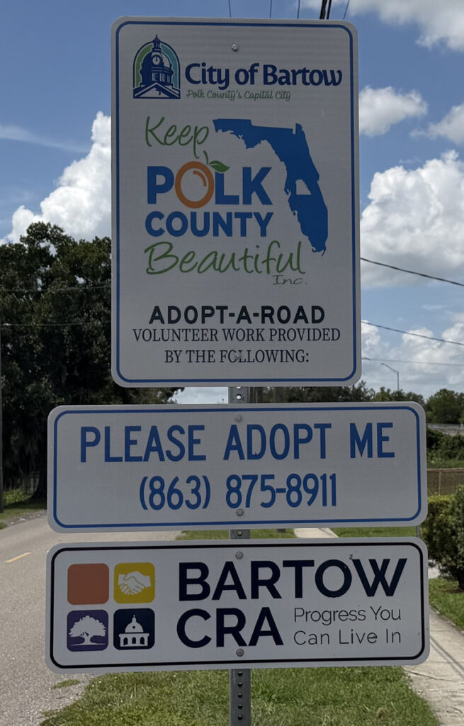 Adopt-A-Road recognition sign in Bartow with City of Bartow, Keep Polk County Beautiful, and Bartow CRA panels